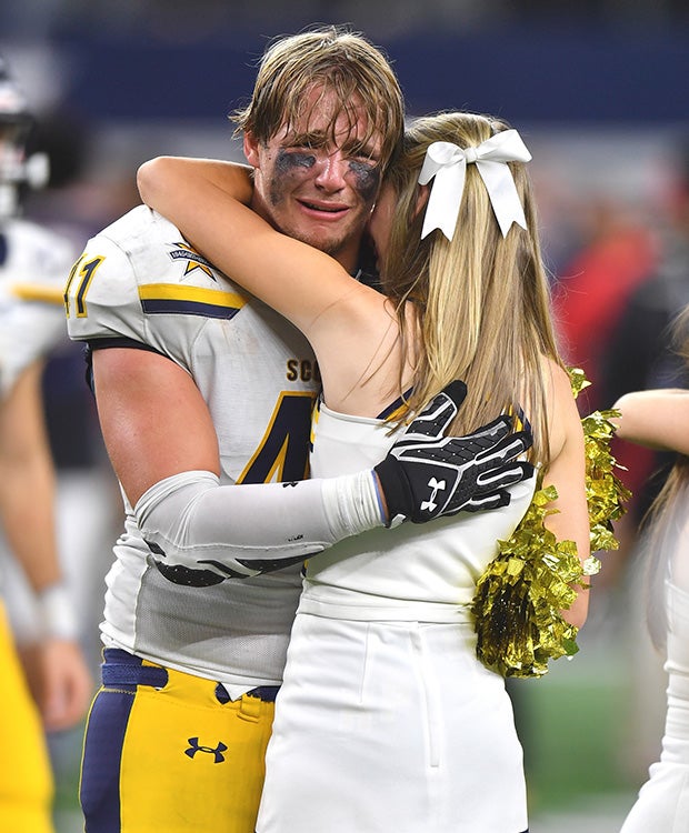 Senior defensive end Elliott Newsom is overcome by emotion after his Highland Park (Texas) Scots' improbable come-from-behind 53-49 victory over Manvel in the UIL 5A Division 1 state title game at AT&T Stadium.
