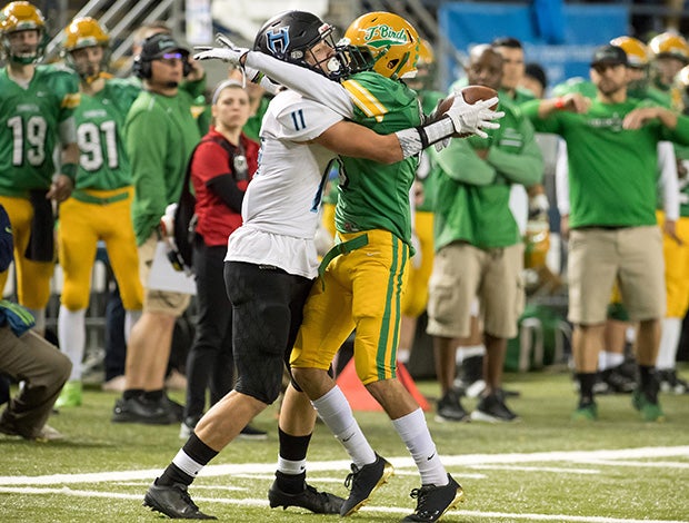 Hockinson (Wash.) receiver Sawyer Racanelli attempts to make a reception behind the back of Turnwater's Zack Gutierrez in the WIAA 2A state championship game.
