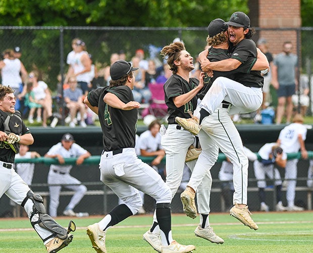 Mountain Vista (Colo.) players rush the mound to celebrate winning the CHSAA 5A state championship.