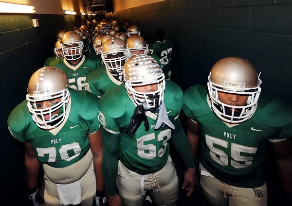Long Beach Poly prepares to take the field prior to its state bowl game against Grant of Sacramento in 2008.