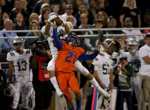 De La Salle's Grant Daley (26) goes up for a 34-yard reception in the first half. 