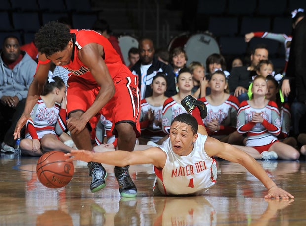 La'vette Parker (right) of Mater Dei fights for a loose ball Saturday in Mater Dei's 59-54 win over Westchester to advance to the CIF Open Division title game.