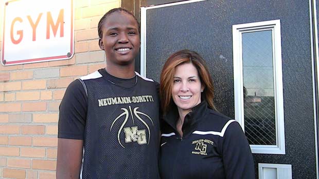 Felicia Aiyeotan, left, and coach Letty Santarelli pose for a photo. Aiyeotan, a Nigerian immigrant, is 6-foot-9 and her feel for the game continues to develop.