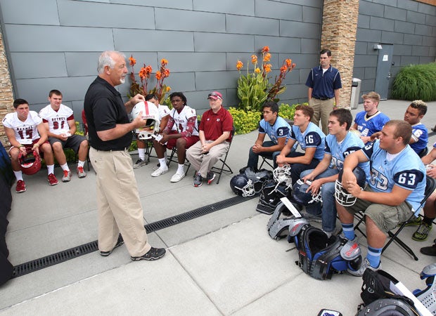 WIAA Assistant Executive Director John Miller speaks to players about proper equipment fitting.
