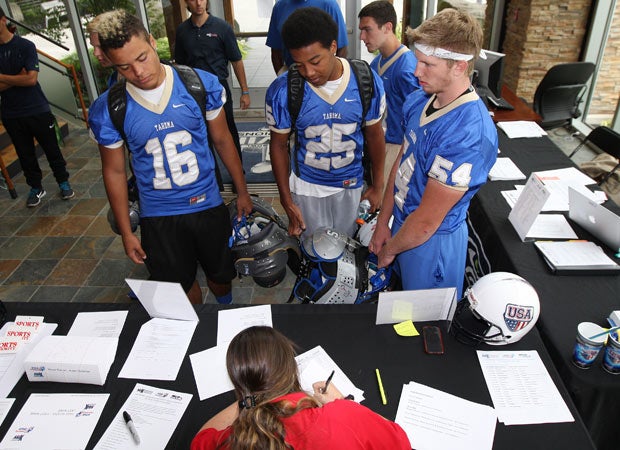 Players from Tahoma High School check in at the lobby of the Seattle Seahawks facility. 
