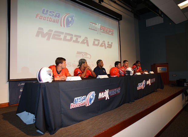 A few players and a coach from Lakes High School take questions from the media during the USA Football/MaxPreps Media Day event held at the Seattle Seahawks facility in Renton on Sunday.