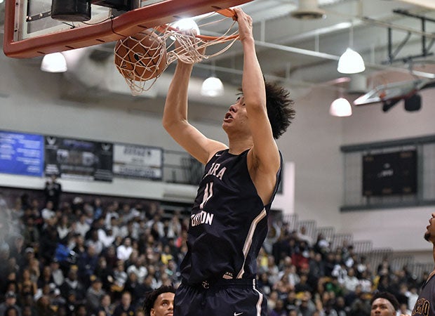 Center Harold Yu finishes a two-handed dunk for Sierra Canyon.