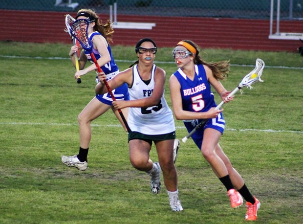 Mariann Trecki (on defense) has gone all-in with lacrosse and results continue to appear.