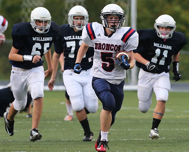 A player on the Boyd (McKinney, Texas) freshman team breaks away from the Williams (Plano, Texas) defense.