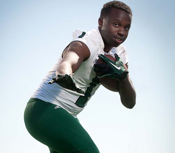 Dalyn Dawkins is back at running back for the Shamrocks, part of the three-pronged attack.