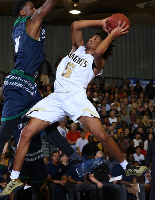 Guard Ethan Thompson takes an off-balance shot in front of a Chino Hills defender.