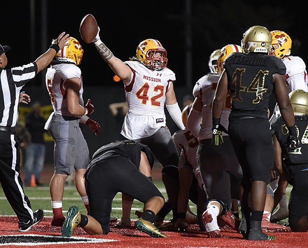 Fullback Shaun Adamson signals scoring a touchdown on a 2-yard run during the second quarter.