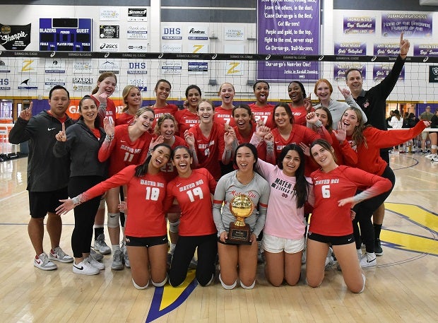 Mater Dei players and coaches celebrate after winning the Durango Fall Classic title on Saturday. The win over Mira Costa in the championship game helped the Monarchs to No. 1 in the MaxPreps Top 25 volleyball rankings. (Photo: Jann Hendry)