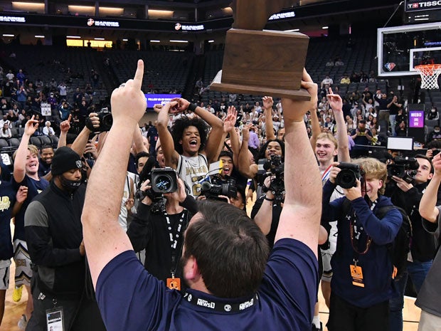 Elk Grove celebrates its first state basketball title.