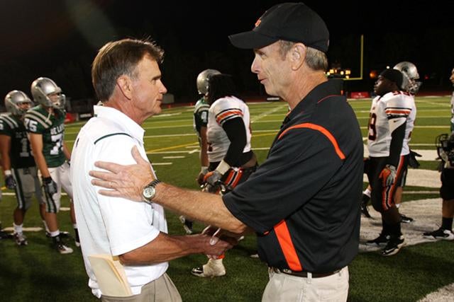 Legendary coaches Bill Castle (right) and Bob Ladouceur congratulate each other after epic overtime game.