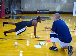 Participants did opposite-hand push-ups at the 2010 Under Armour Elite Combine.