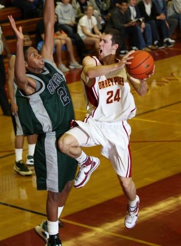 Trevor Newquist drives hard to the basket.