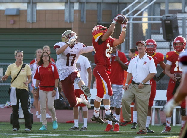 Cathedral Catholic's Hogan Irwin secures the interception. 