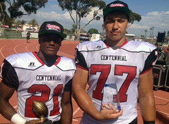 Centennial MVPs J.J. Taylor (21) and Sid Acosta (77)
