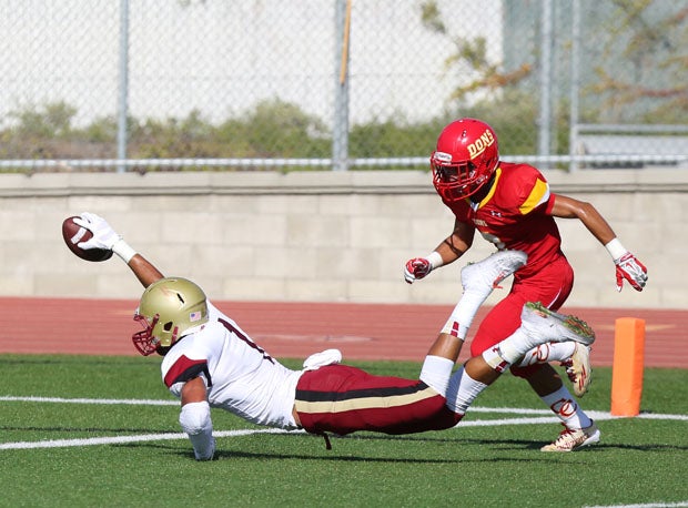 Oaks Christian receiver Michael Pittman reaches for the end zone. 