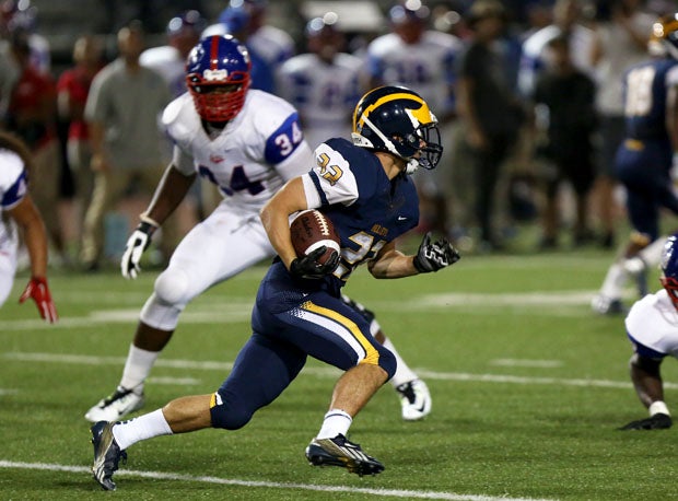 Sam Richmond (22) led Bellevue with 81 yards on 22 carries and three touchdowns as the Wolverines rolled to a 31-14 win over Serra in the premier game of the 2014 Southern California Honor Bowl at Oceanside High School. 