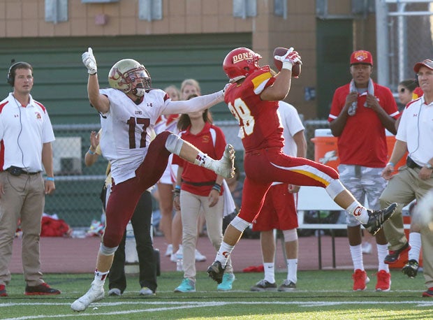 Cathedral Catholic's Hogan Irwin (28) goes high for an interception. 