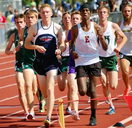 Dakota Ridge senior Danny Carney, left, and Denver East sophomore Cerake Geberkidane, right, lead the pack during the Class 5A boys 3,200-meter final. Fort Collins senior Griffin Hay, in purple, pulled off the victory with a sprint down the stretch Thursday.