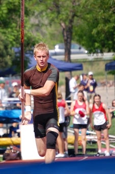 Bear Creek senior Nick Dalton prepares
to make his jump during the Class 5A
boys pole vault. Dalton won with a jump
of 15 feet, 9 inches.