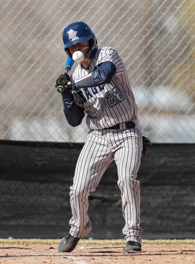 Duchesne (Utah) batter  Cade Gines takes a pitch on the chin during a recent game.
