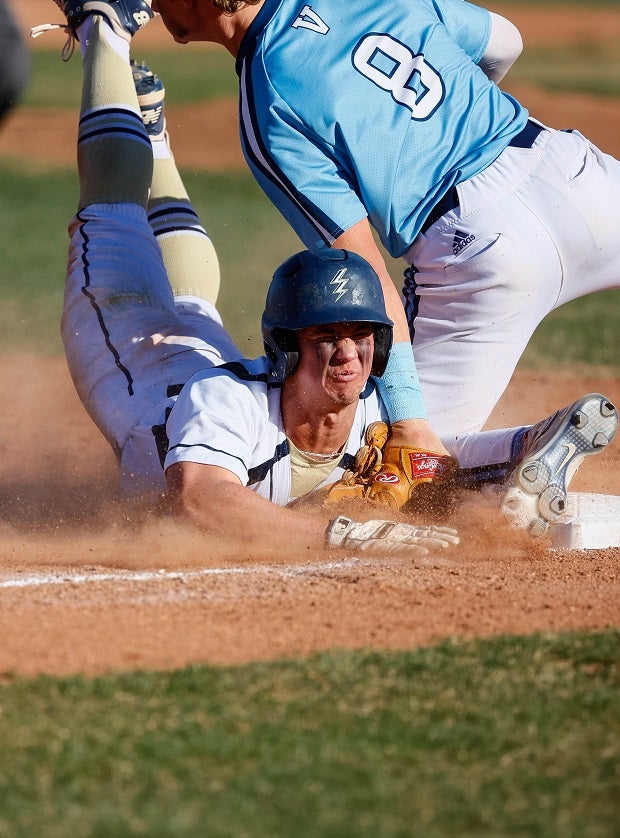 Valor Christian (Colo.) third baseman Carson Tinney puts the tag on Legacy's Braden Hollis during a steal attempt.