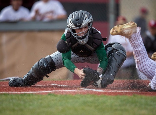 Mountain Vista senior catcher Blake Young waits to tag a Ponderosa runner out at home in the first inning of a recent game.