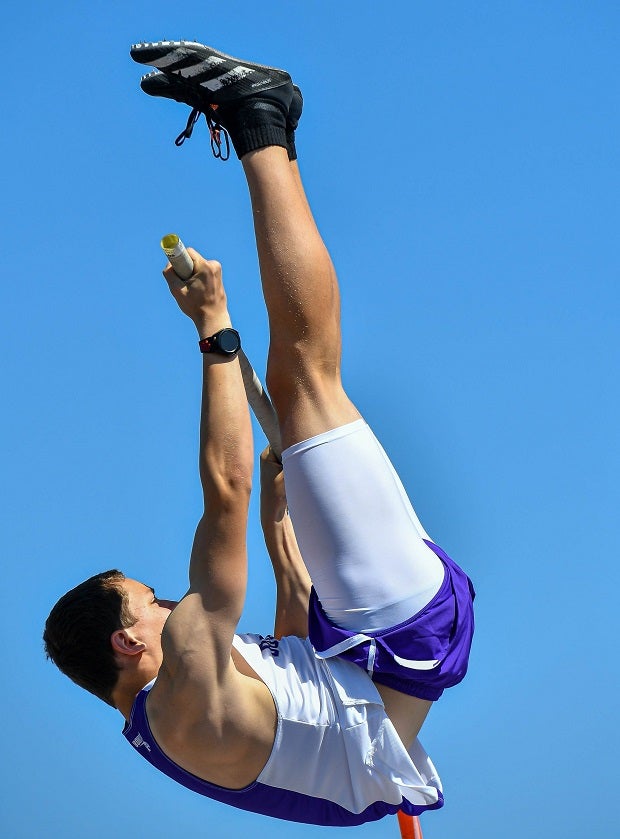 Cameron Upchurch of Hallsville (Texas) soars during his pole vault attempt at the UIL 15 5A District meet.