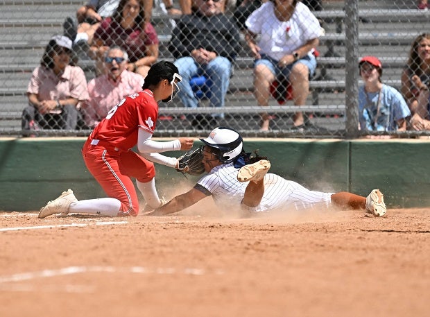 Lee (Texas) pitcher Larisa Tinajero tags a Madison player in the head at home during a district contest.