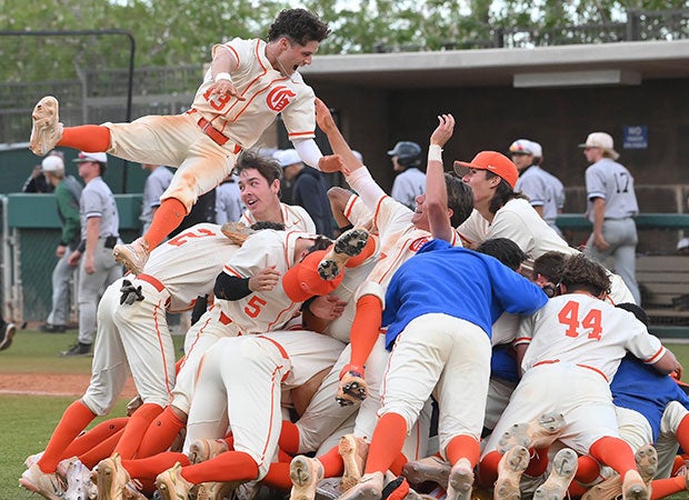 Bishop Gorman (Nev.) senior Santino Panaro leaps onto the dogpile of teammates while celebrating the Gaels' victory in the NIAA 5A Southern Region championship game.