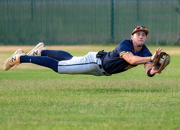 Cape Fear (N.C.) outfielder Jason Quesenberry makes a diving catch against host Pine Forest.