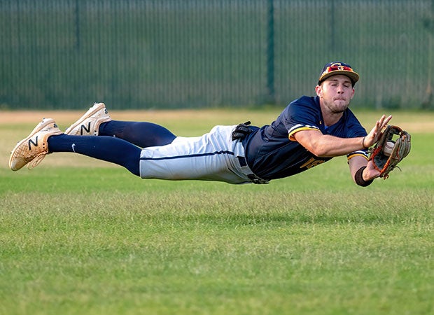 Cape Fear (N.C.) outfielder Jason Quesenberry makes a diving catch against host Pine Forest. 