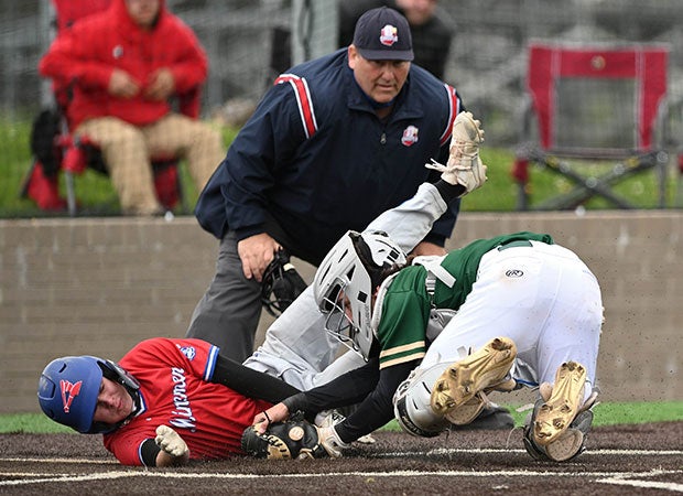 GlenOak (Ohio) catcher Tristan Mengeu tags out Revere's Nolan Williams at home plate.