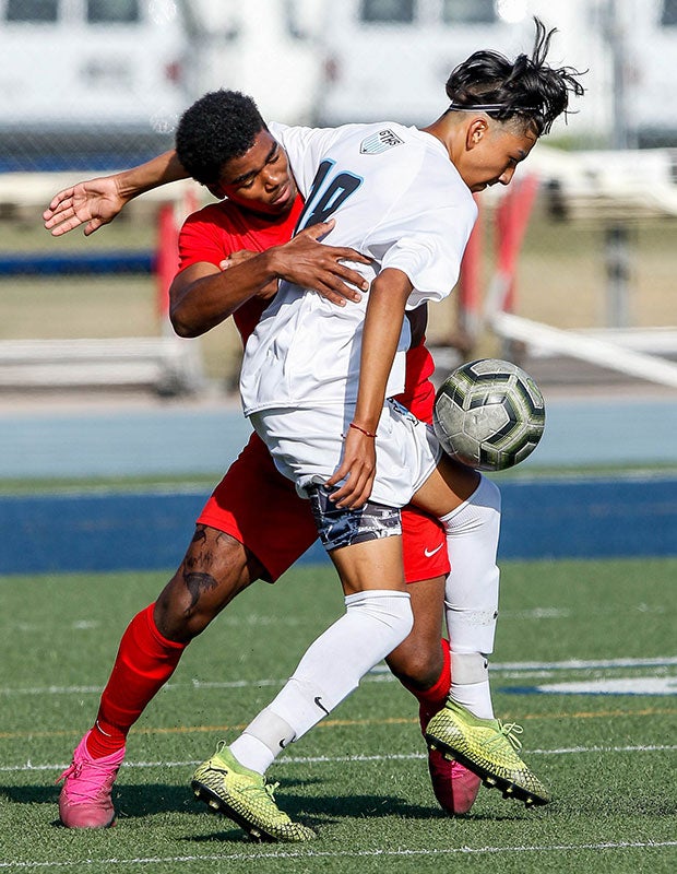 Joseph Flores (right) of Grand Terrace (Calif.) gets tangled with La Salle's Oshea Foster for control of the ball.