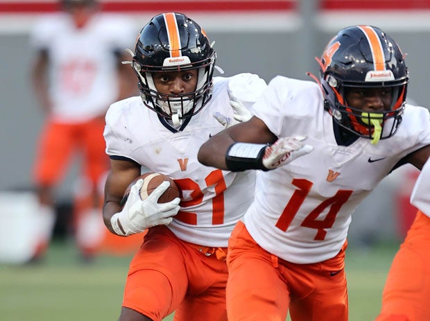 Asuani Allen running the ball for Vance in its 4AA championship win over Rolesvile on Saturday at North Carolina State's Finley Stadium.