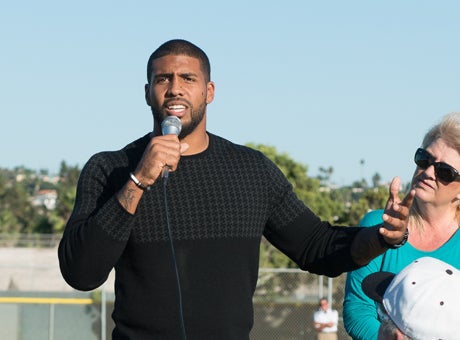 Arian Foster speaks at an intimate ceremony at Mission Bay High School today after the school retired his No. 2. 