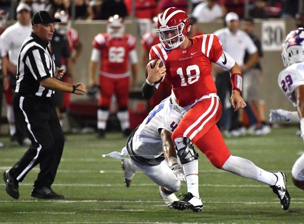 Mater Dei quarterback J.T. Daniels scrambles out of trouble in the first half of Friday's win over Bishop Gorman.