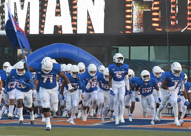 No. 11 Bishop Gorman runs onto the field Friday before the season-opening 42-21 win over St. Louis.