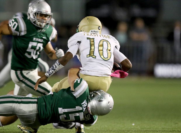 Joe Vranesh with one of De La Salle's four sacks on Friday against Long Beach Poly.