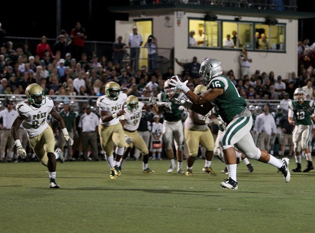 Devin Asiasi catches one of his two touchdown passes from Anthony Sweeney. 