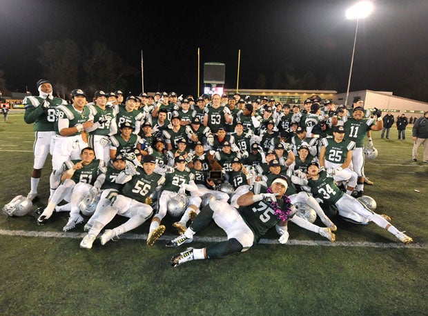 De La Salle celebrates its CIF state championship at Sacramento State University after a 28-21 win over Centennial. 