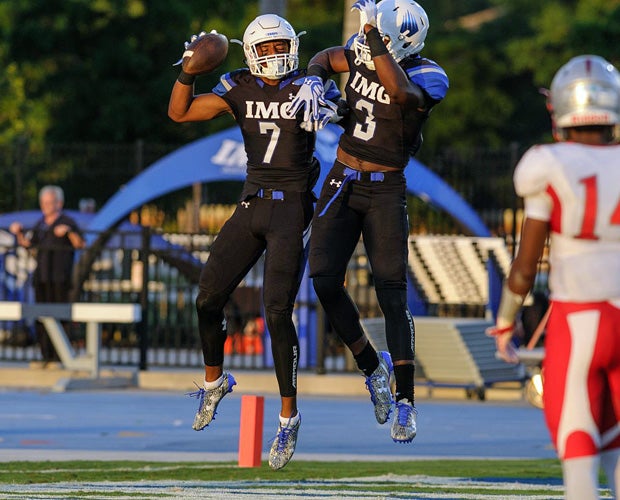 IMG Academy receiver Brian Hightower celebrates his 65-yard touchdown reception with teammate Tre' Mckitty in the first quarter.