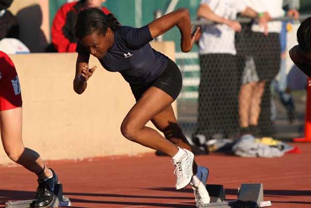 Inderkum senior Brittany Adams explodes out of the blocks during Friday's 100 finals.
