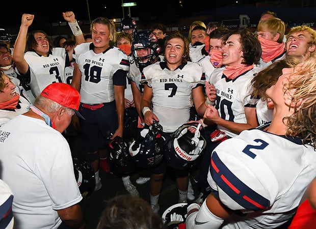 Springville players celebrate following their season-opening victory over Dixie.