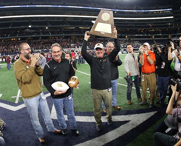 Aledo head coach Steve Wood hoist the state championship trophy.