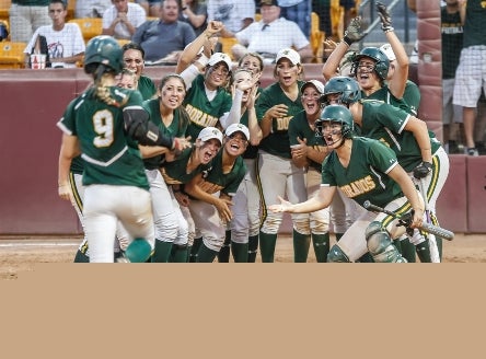 Kayla Bonstrom is greeted at home plate by her Canyon Del Oro (Tucson) teammates after hitting a home run in the Division II title game.